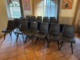 a room with a bunch of chairs and a radiator in it