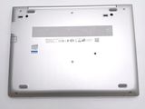 a laptop that is sitting on a white surface