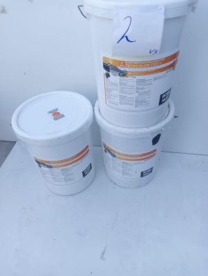 three buckets of paint sitting next to each other on the floor