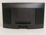 a close up of a black television on a white surface
