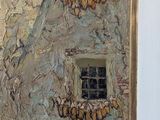 a painting on the wall of a building with a window