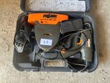 a tool in the case that is sitting on the floor
