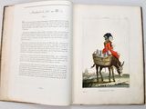 an open book with a picture of a woman riding a donkey