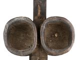 a small metal object with a cross on it