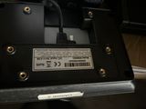 a close up of a black device with a barcode on it