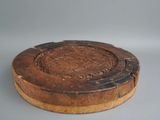 an old wooden box with a carved design on the lid