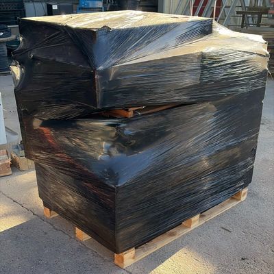two black boxes stacked on top of each other on a pallet