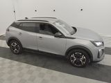 the silver suv is parked in the garage on a checkered floor