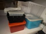 three plastic containers sitting on a shelf next to each other