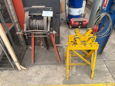 a machine that is sitting on the ground next to other machines