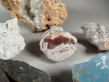 many different types of rocks on a white surface