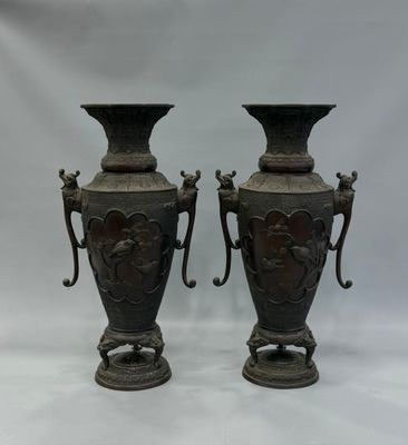 pair of antique bronze vases with handles and handles