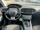 the interior of a car with a steering wheel and dashboard controls