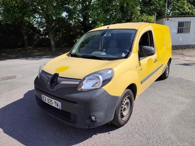a yellow van that is parked in the parking lot