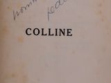 an old book with writing on it sitting on a table