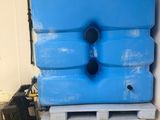 a large blue container sitting on top of a pallet