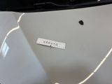 a sticker on the hood of a white car