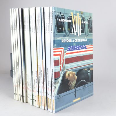 a lot of books that are stacked on top of each other