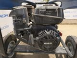 a small engine that is sitting on a cart