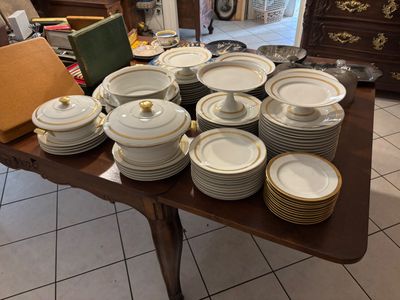 a table with many plates and bowls on it