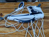 a white and blue steam iron on a wooden table