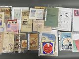 many different types of postcards on display on a table