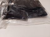 a bag of chocolates on a table with a pair of scissors in it
