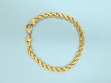 a gold chain bracelet with a clasp on a blue background