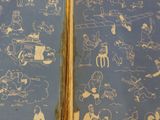 two books with drawings on them sitting on a table