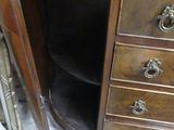 a wooden desk with a mirror on top of it