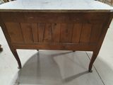 a marble top on a wooden table in a store
