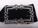 an image of a black velvet belt with a silver buckle on it
