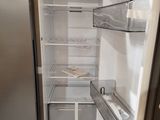 an open refrigerator with the door open in a kitchen