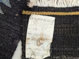a close up of a piece of fabric with a tag on it