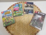 a lot of video games sitting on a table
