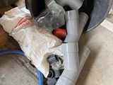 an image of a trash can and a blow dryer on the floor