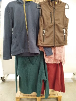 three jackets and a skirt on a rack in a store
