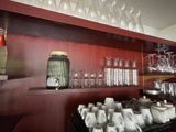 many glasses and cups on the shelves in the room