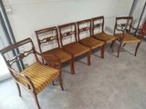 four chairs and a bench are lined up in a row