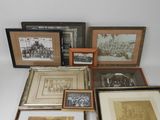 several framed photographs of people and animals are displayed on a table