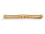 une broche en forme de barre en or jaune 18 carats et diamants