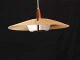 a close up of a light hanging from a ceiling lamp