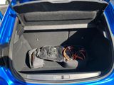 a boot of a car with a boot bag in the trunk
