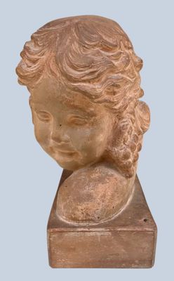 an image of a statue of a child with a ball in his hand
