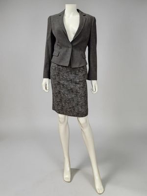 an image of a mannequin wearing a skirt suit and jacket
