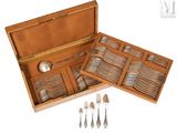 a wooden box with silverware in it on a white background