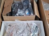 a box of assorted electronics in it on the floor