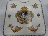 a plate with a picture of a woman and a cat on it