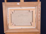 an old picture of a wooden easel with a piece of paper on it