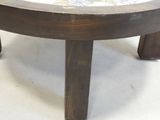 a coffee table that has a marble top on it